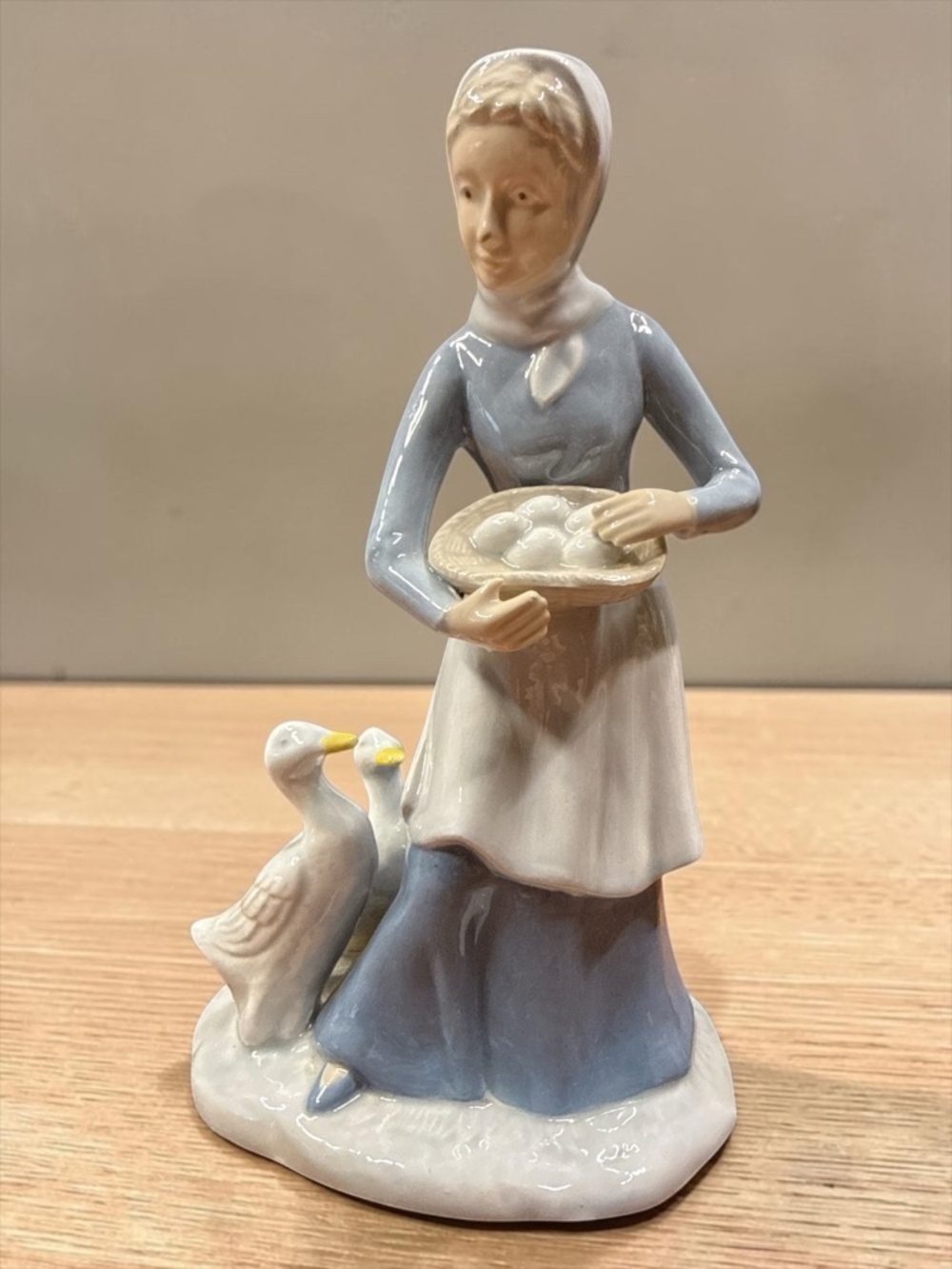 Woman Collecting Eggs with Geese Figurine